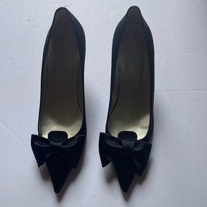 Pair of Anne Klein black dress shoes with bow.